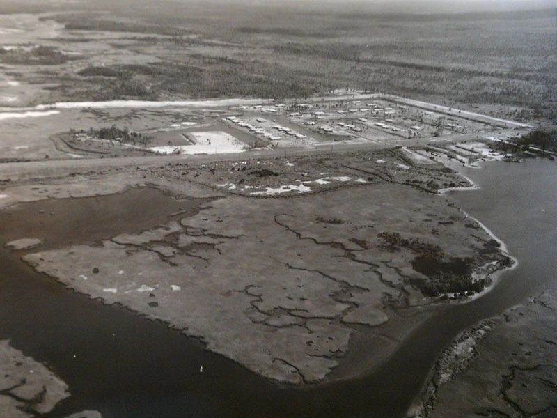 Development surrounded by marshland